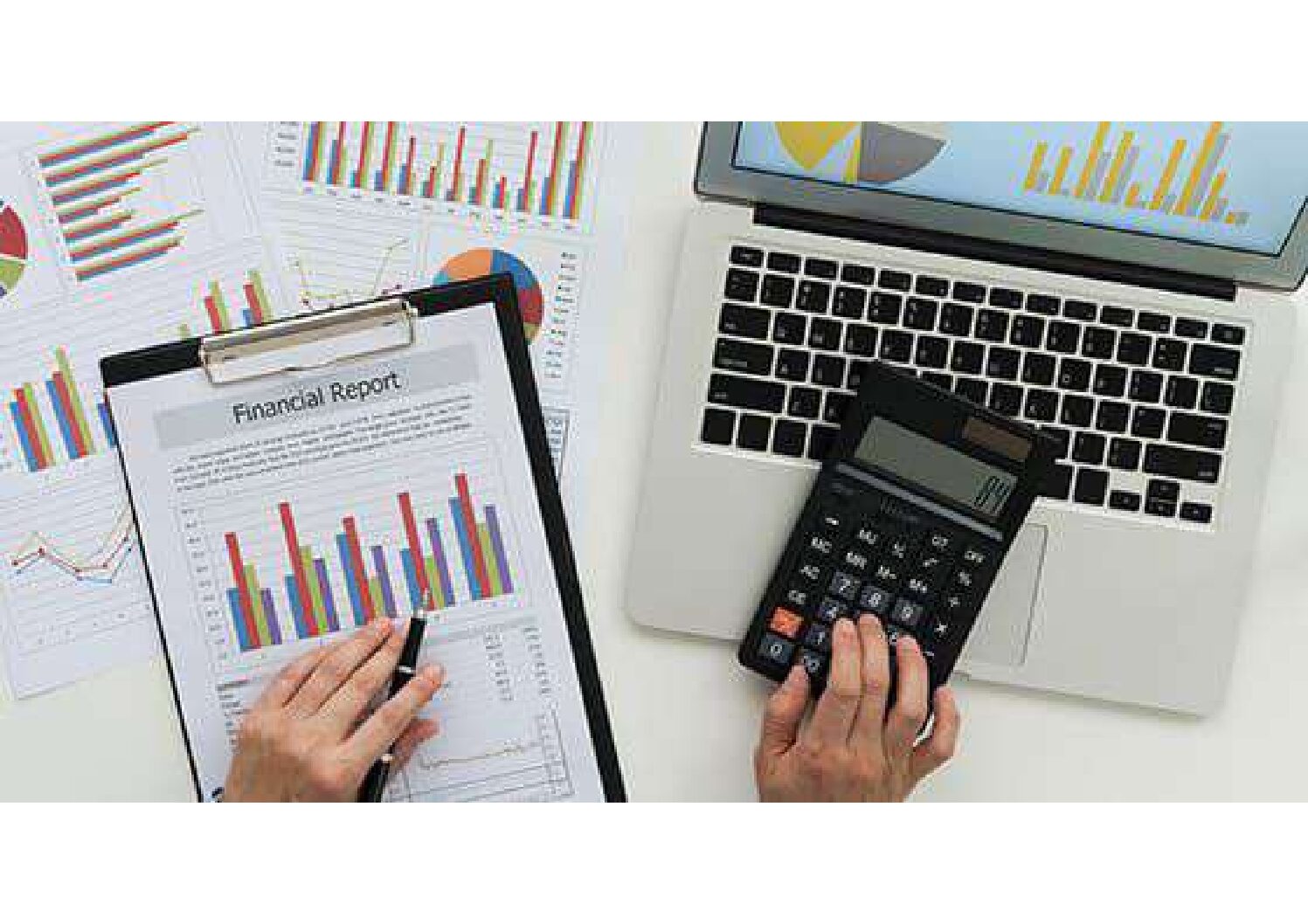 person-working-on-financial-statements-with-laptop-and-calculator